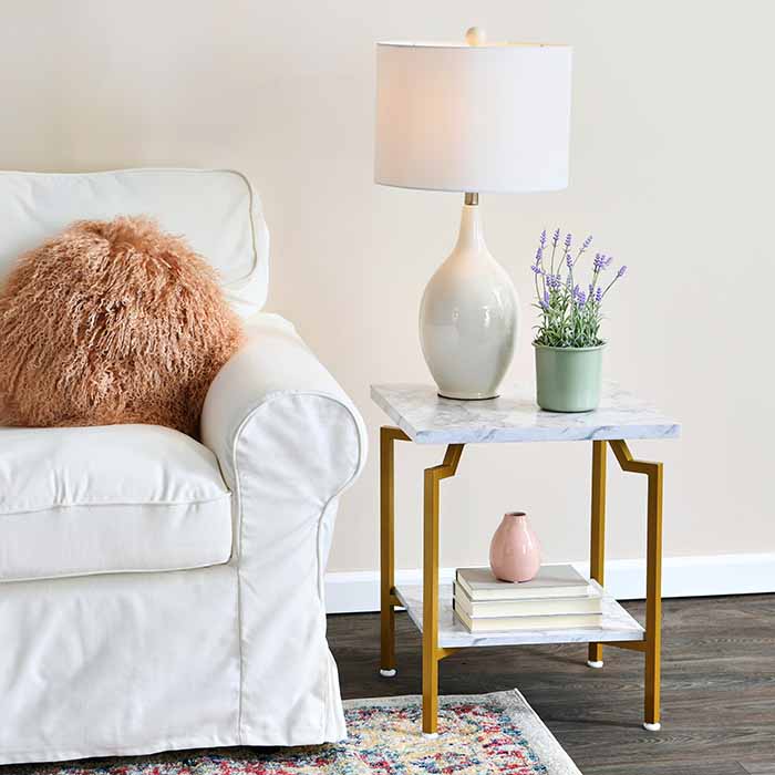 White couch with end table and lamp
